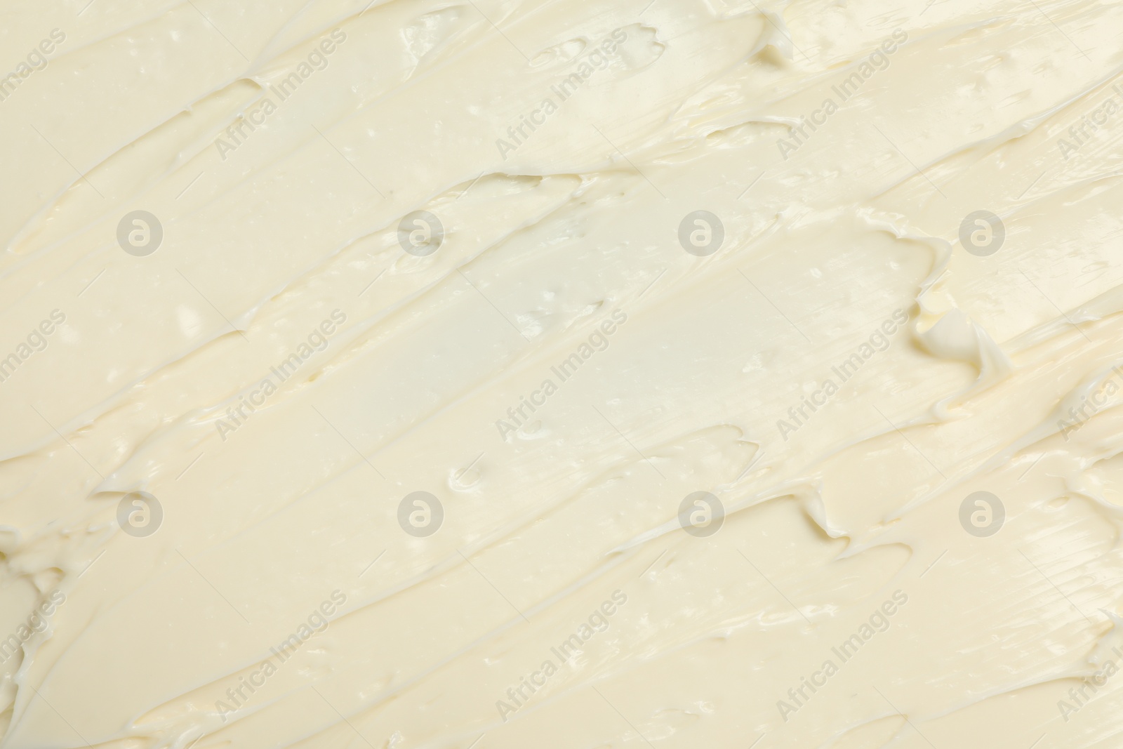 Photo of Texture of tasty butter as background, top view