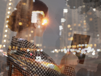 Image of Double exposure of young woman using tablet and night cityscape. Financial analytics