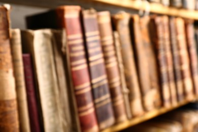 Blurred view of old books on shelf in library