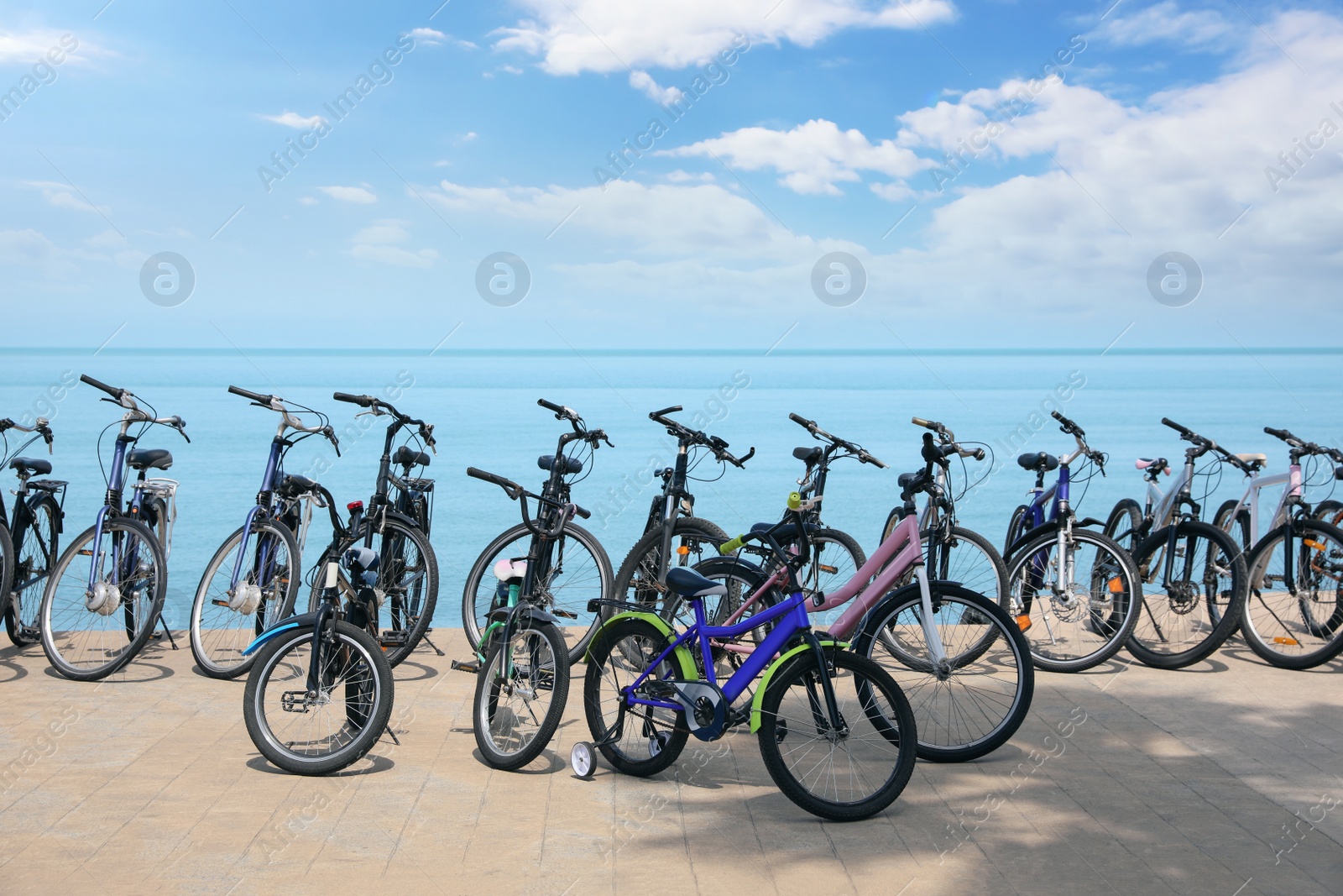 Photo of Parking with bicycles on embankment near sea