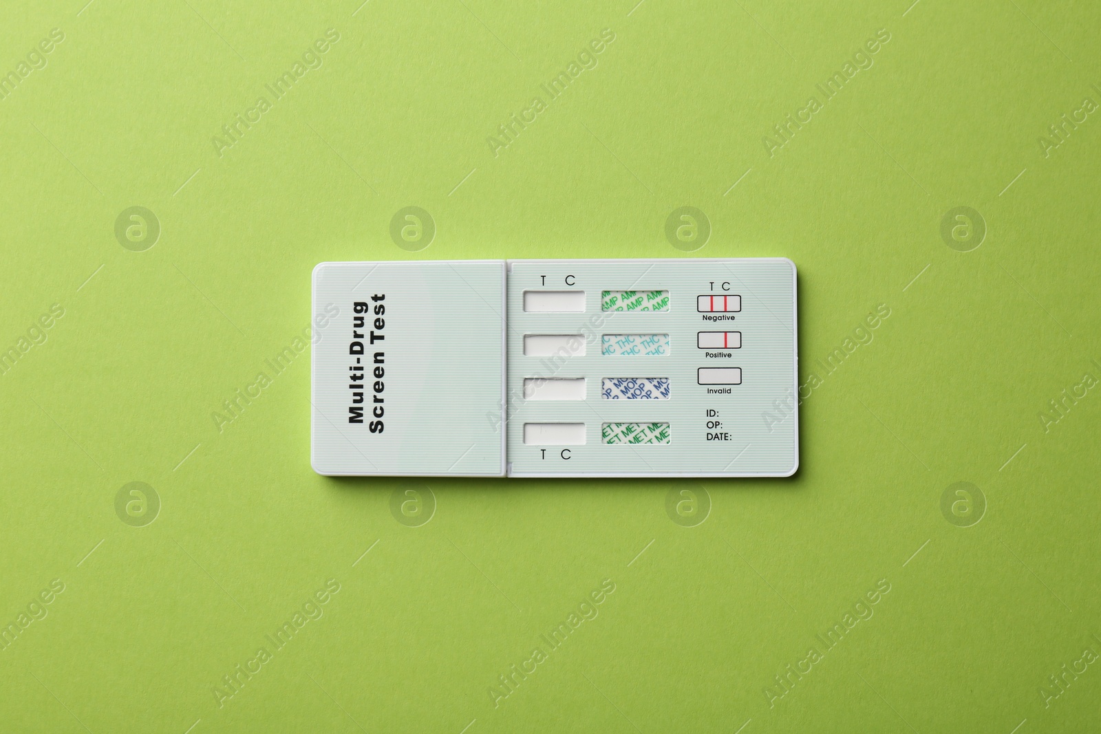 Photo of Multi-drug screen test on light green background, top view
