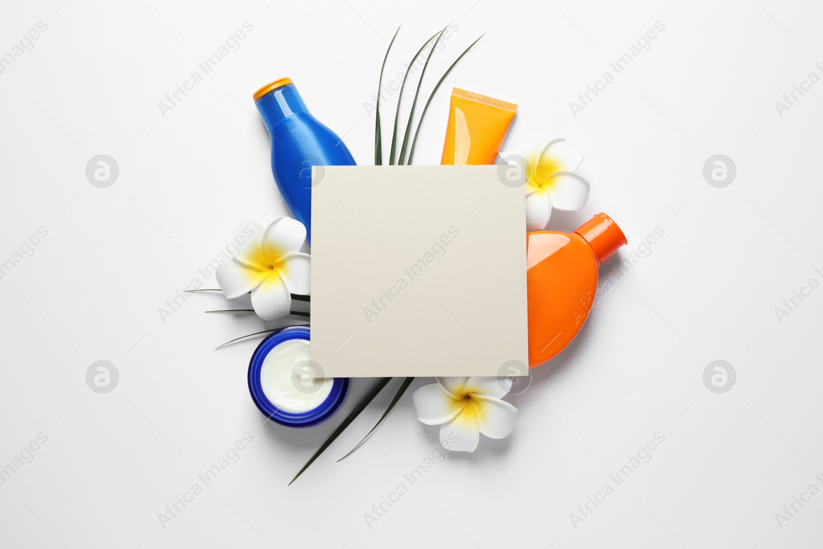 Photo of Composition with sun protection cosmetic products on white background, top view. Space for text