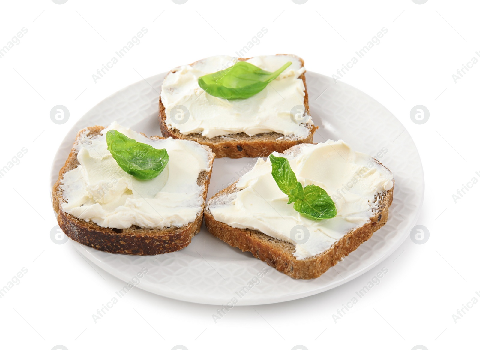 Photo of Bread with cream cheese and basil on white background