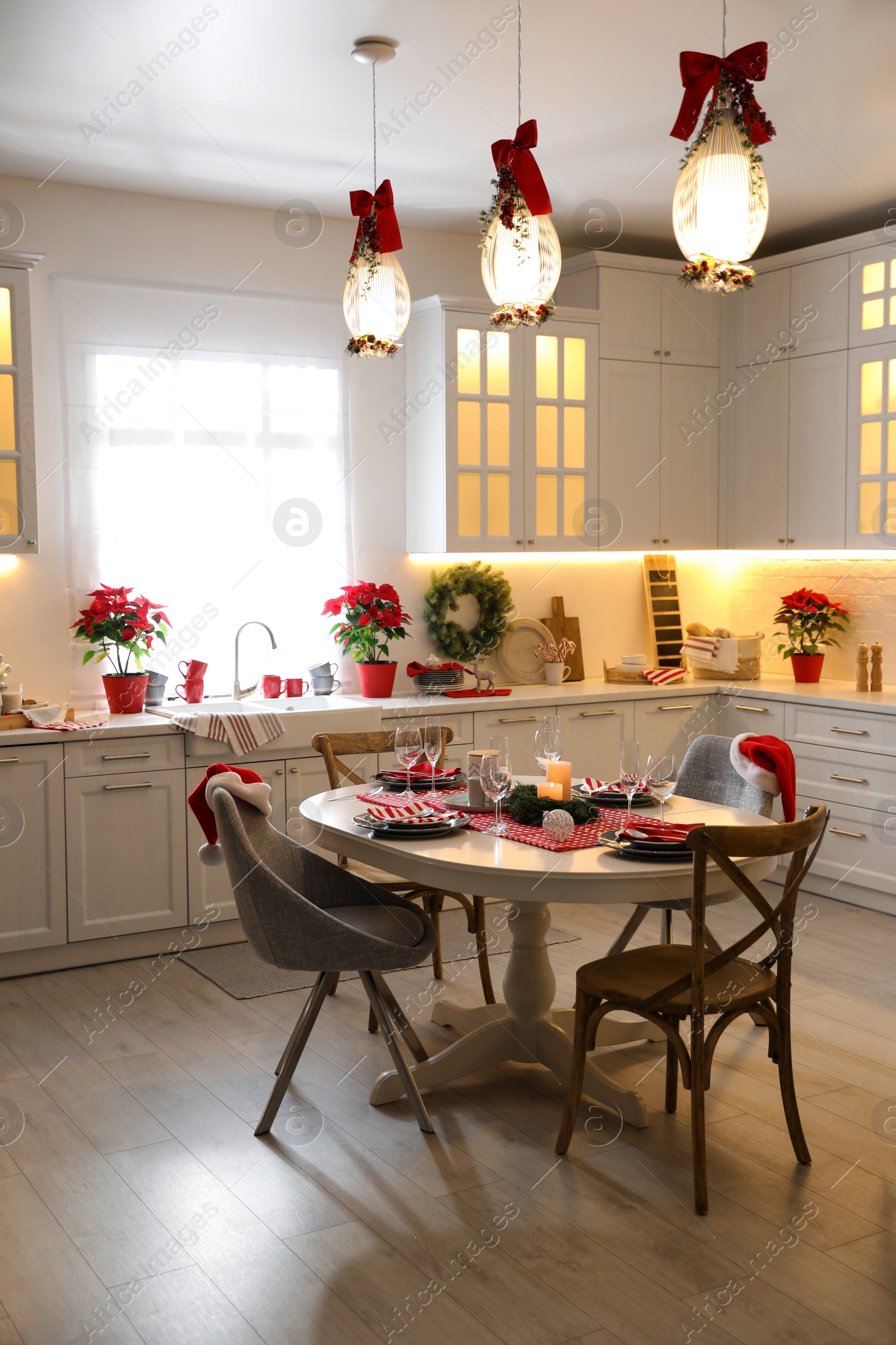 Photo of Stylish kitchen interior with beautiful Christmas decor