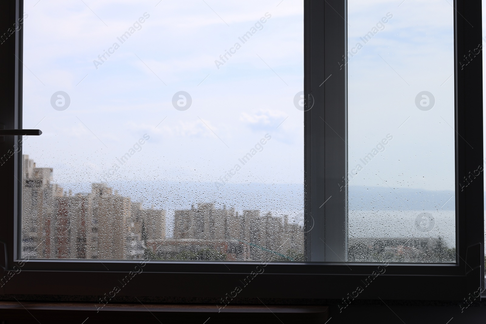 Photo of Window with water drops on rainy day