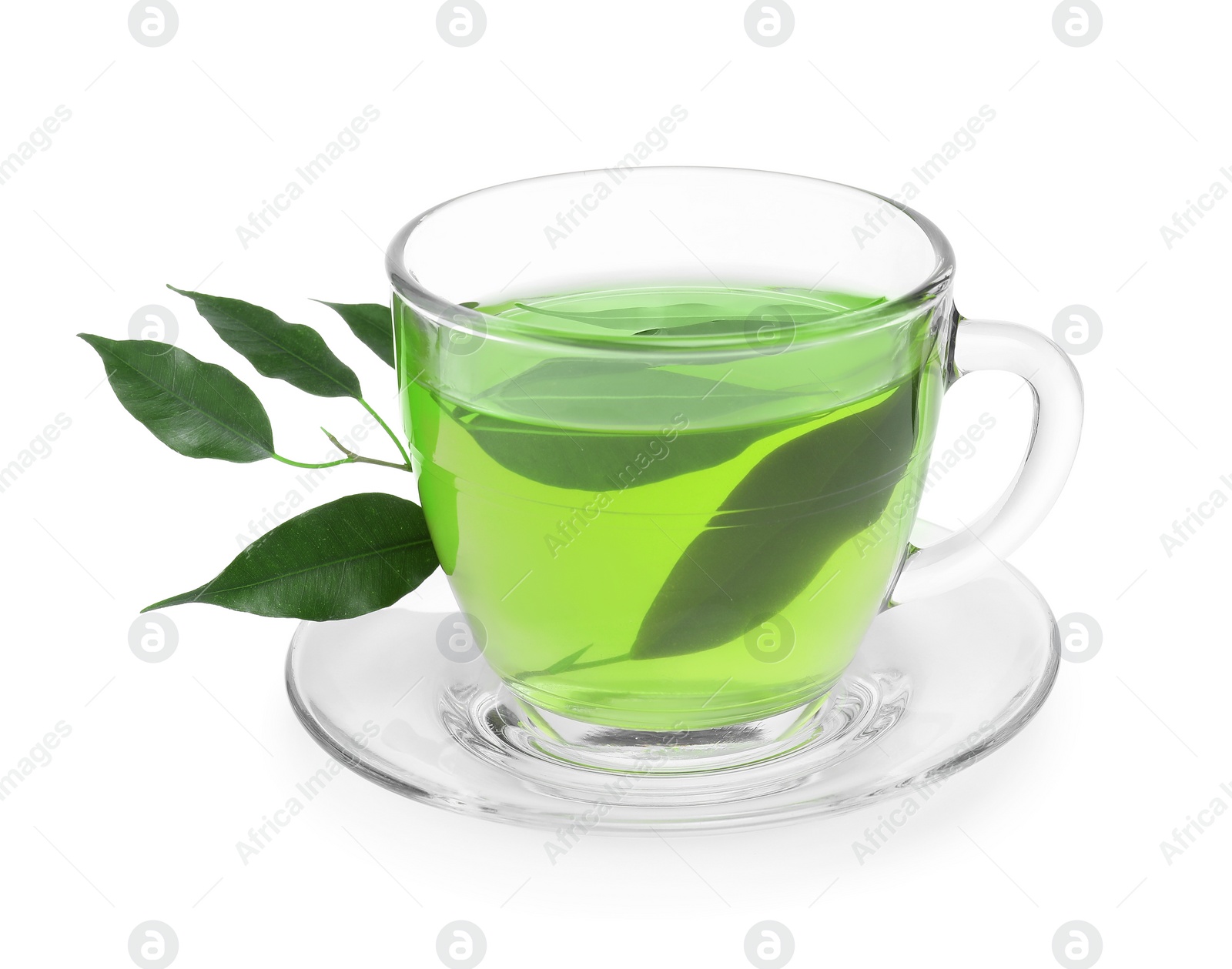 Photo of Fresh green tea in glass cup, leaves and saucer isolated on white