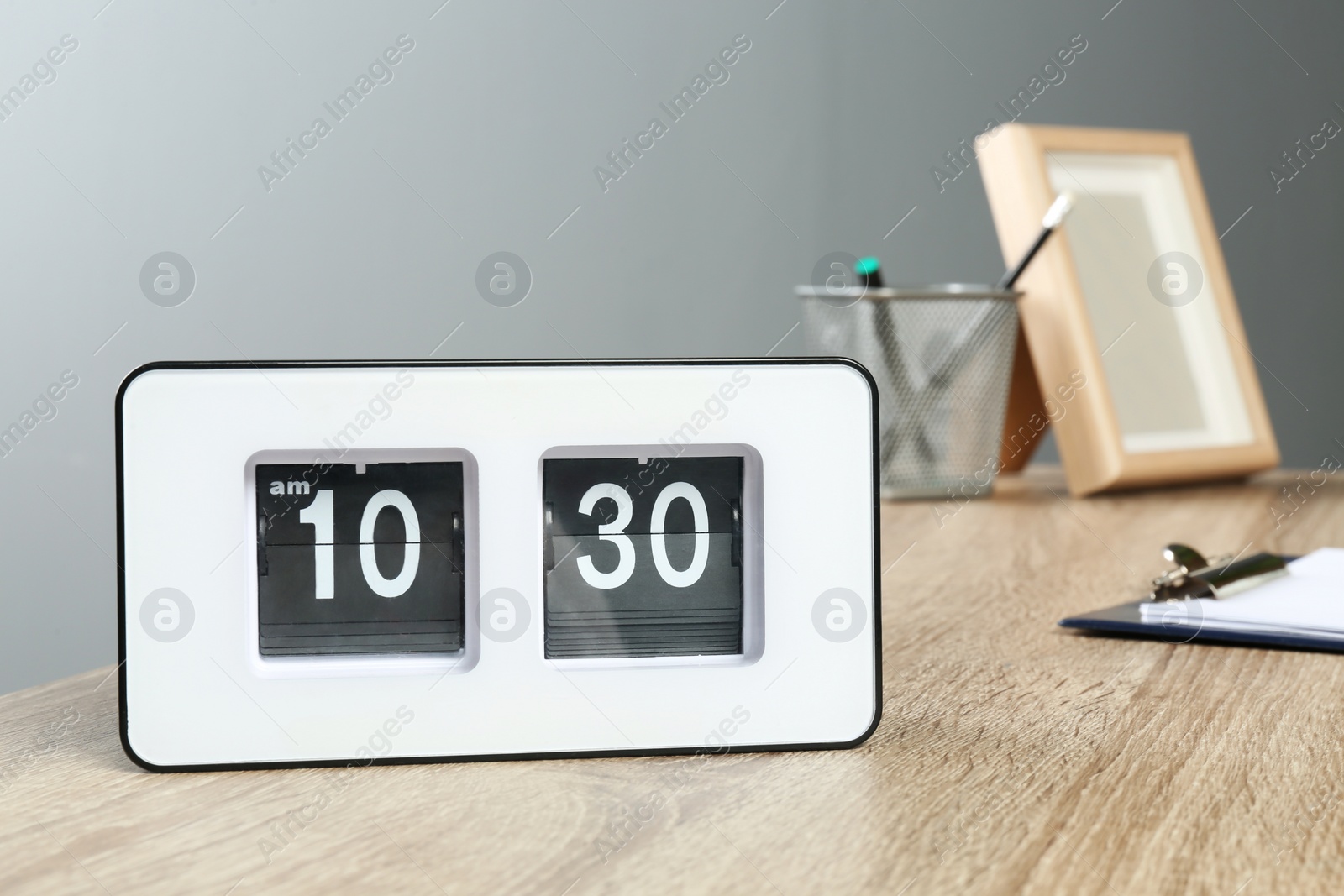 Photo of Stylish flip clock on table in office,  space for text. Time management