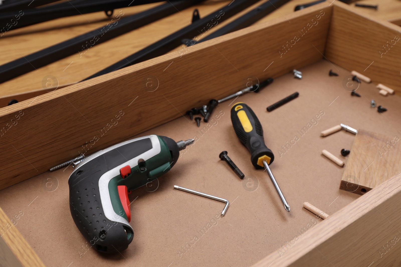 Photo of Equipment for furniture assembly inside of wooden drawer