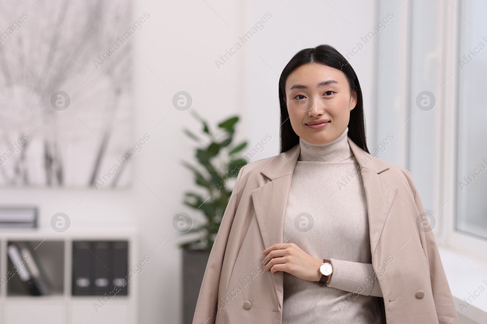 Photo of Portrait of beautiful businesswoman in office. Space for text