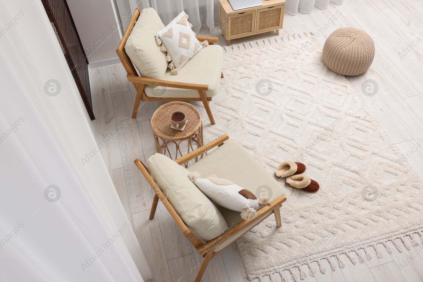 Photo of Stylish living room with soft white carpet and furniture, above view. Interior design