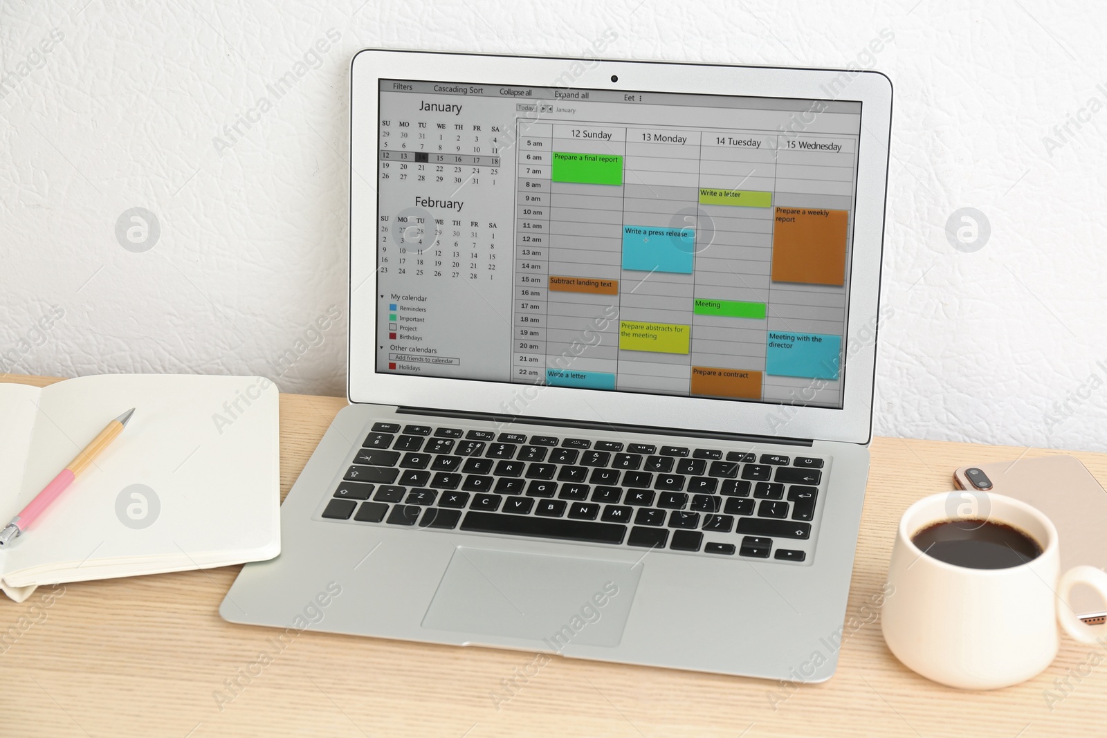 Photo of Modern laptop with calendar app in office