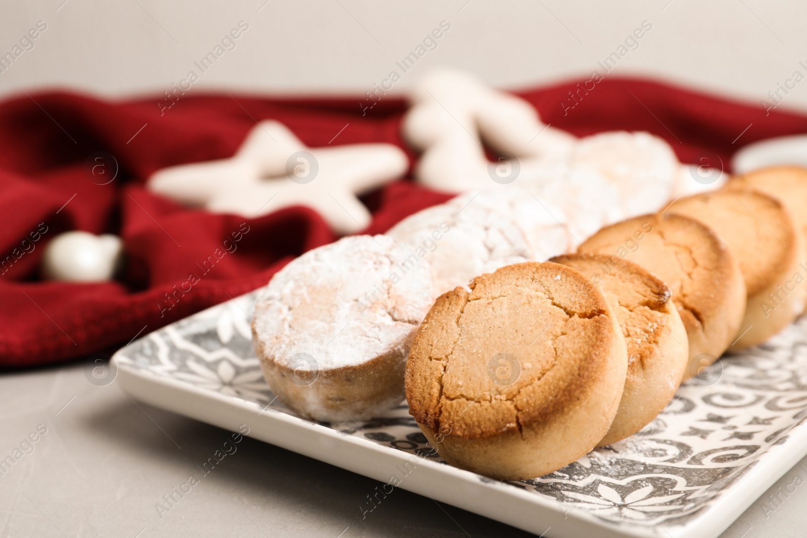 Photo of Tasty homemade cookies on light grey table, closeup