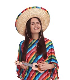 Photo of Young woman in Mexican sombrero hat and poncho playing ukulele on white background