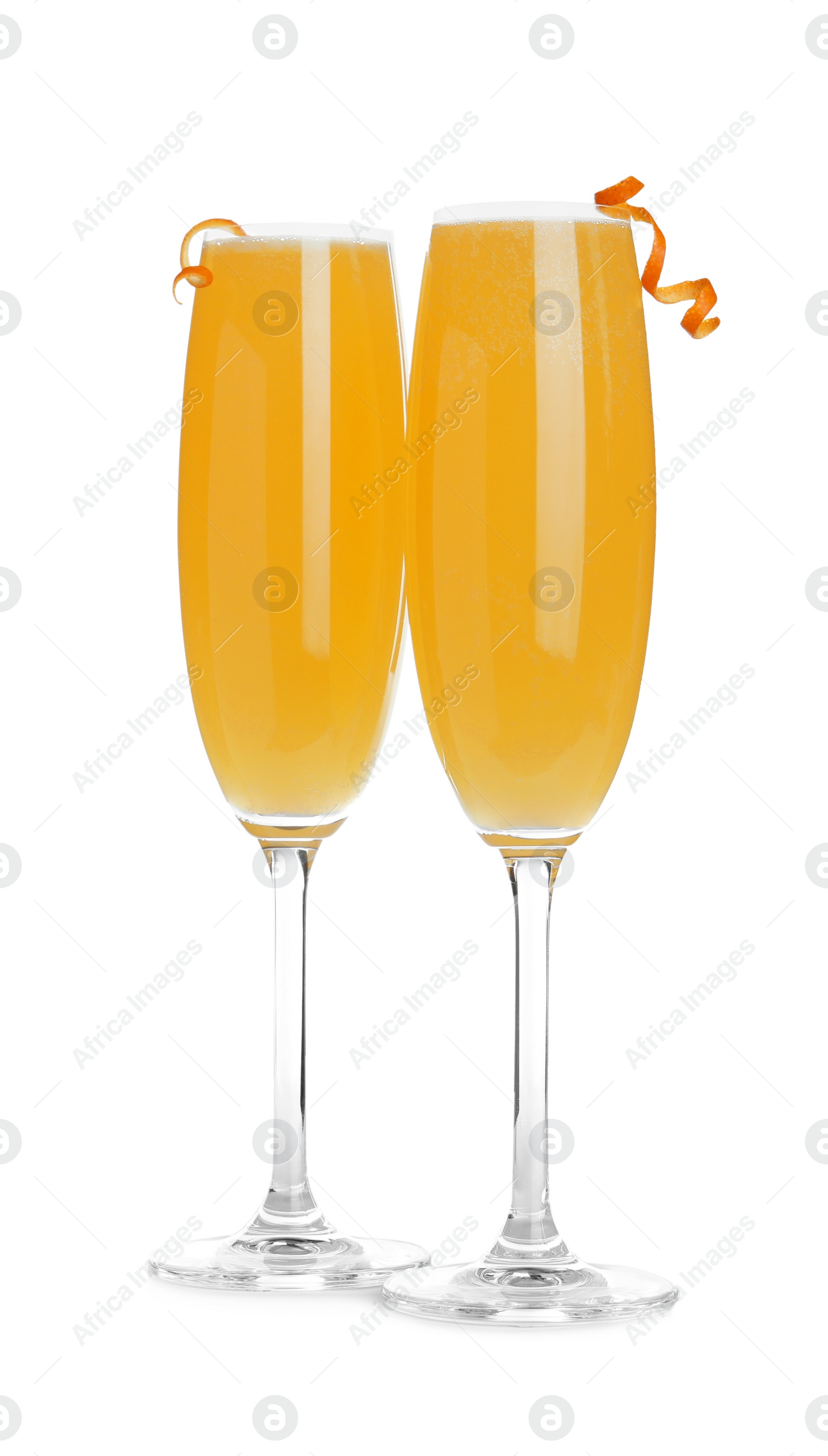 Photo of Fresh alcoholic Mimosa cocktails decorated with orange peels on white background
