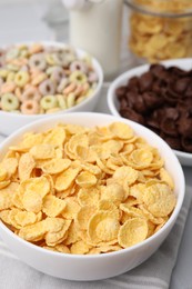 Photo of Different delicious breakfast cereals on table, closeup