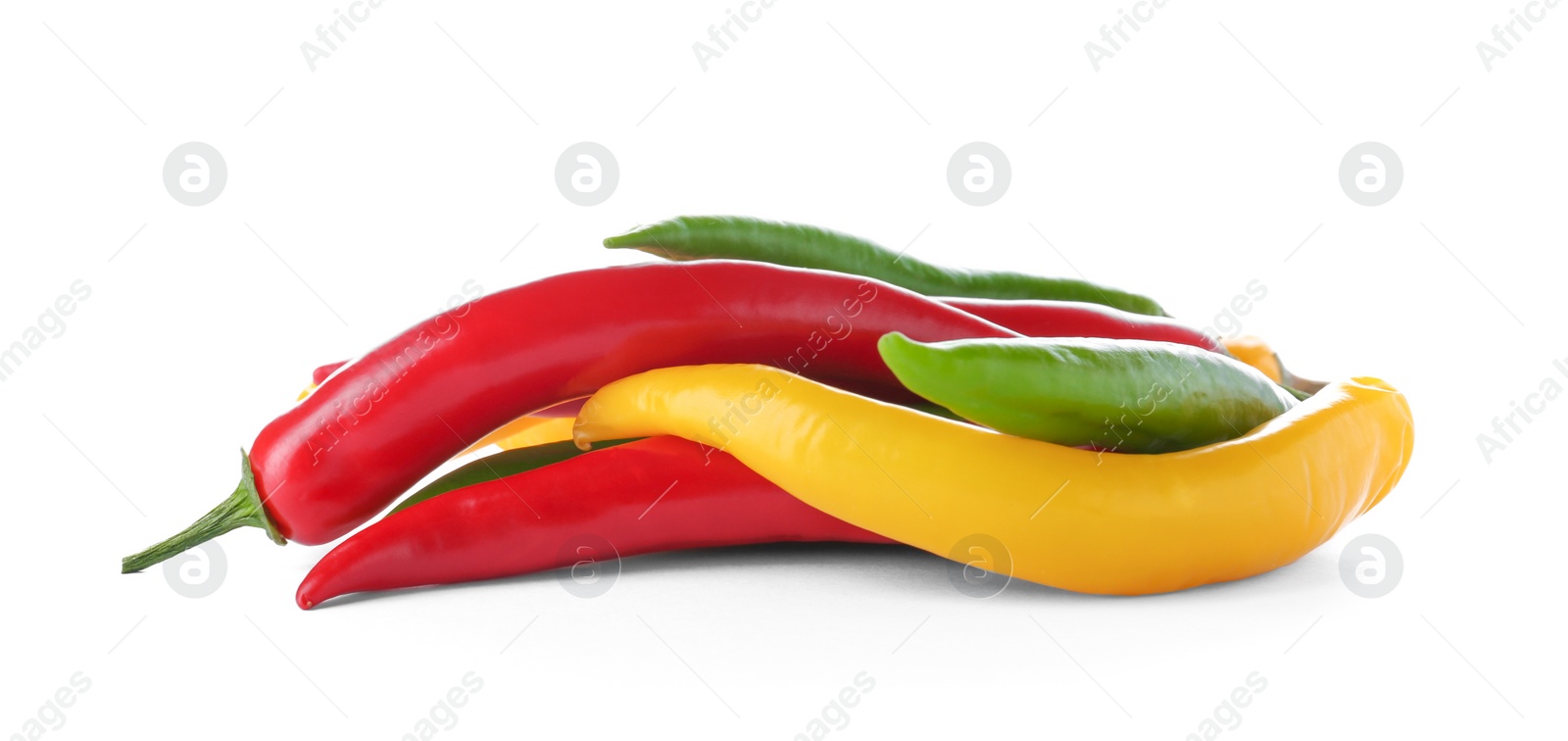 Photo of Ripe hot chili peppers on white background