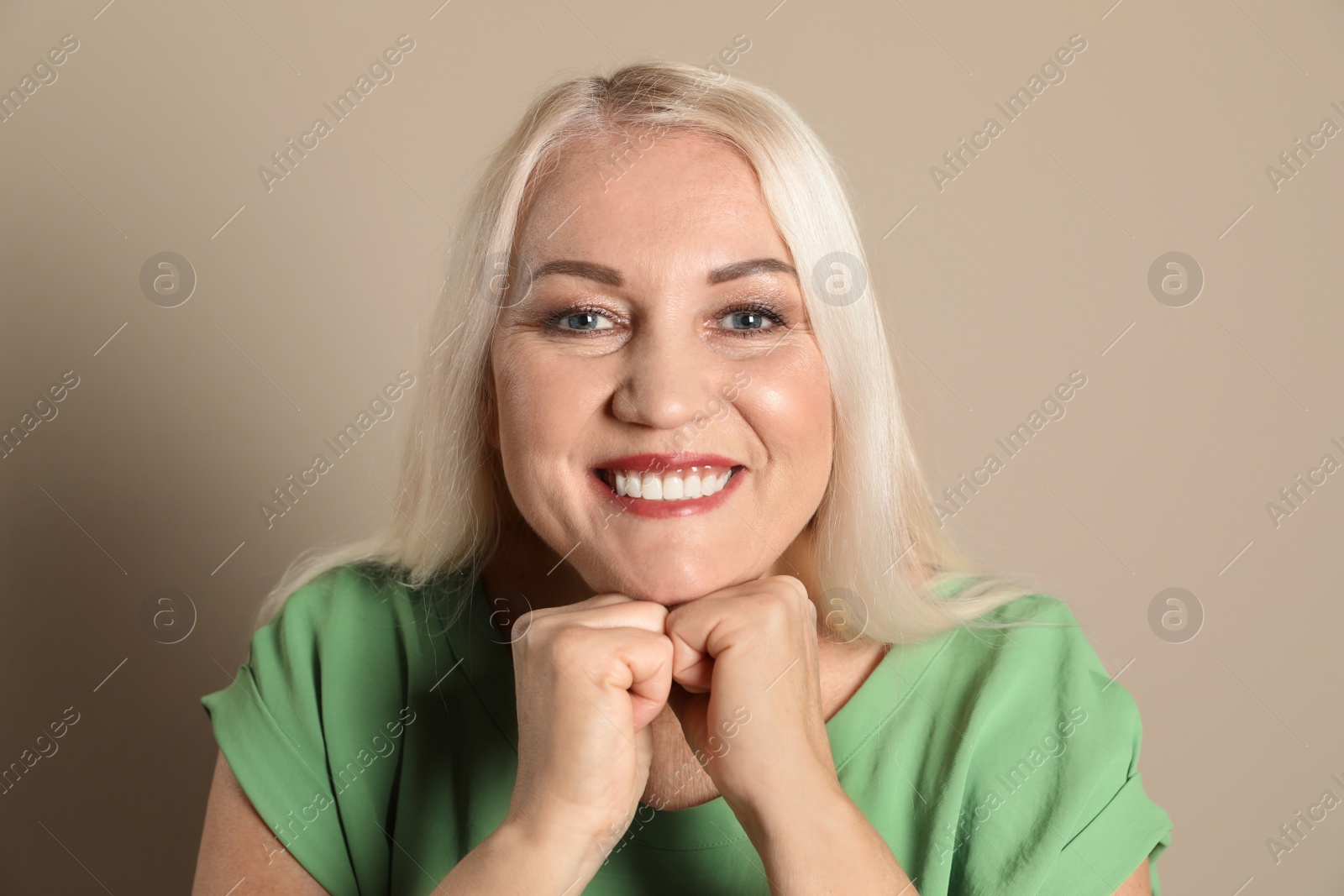 Photo of Smiling woman with perfect teeth on color background