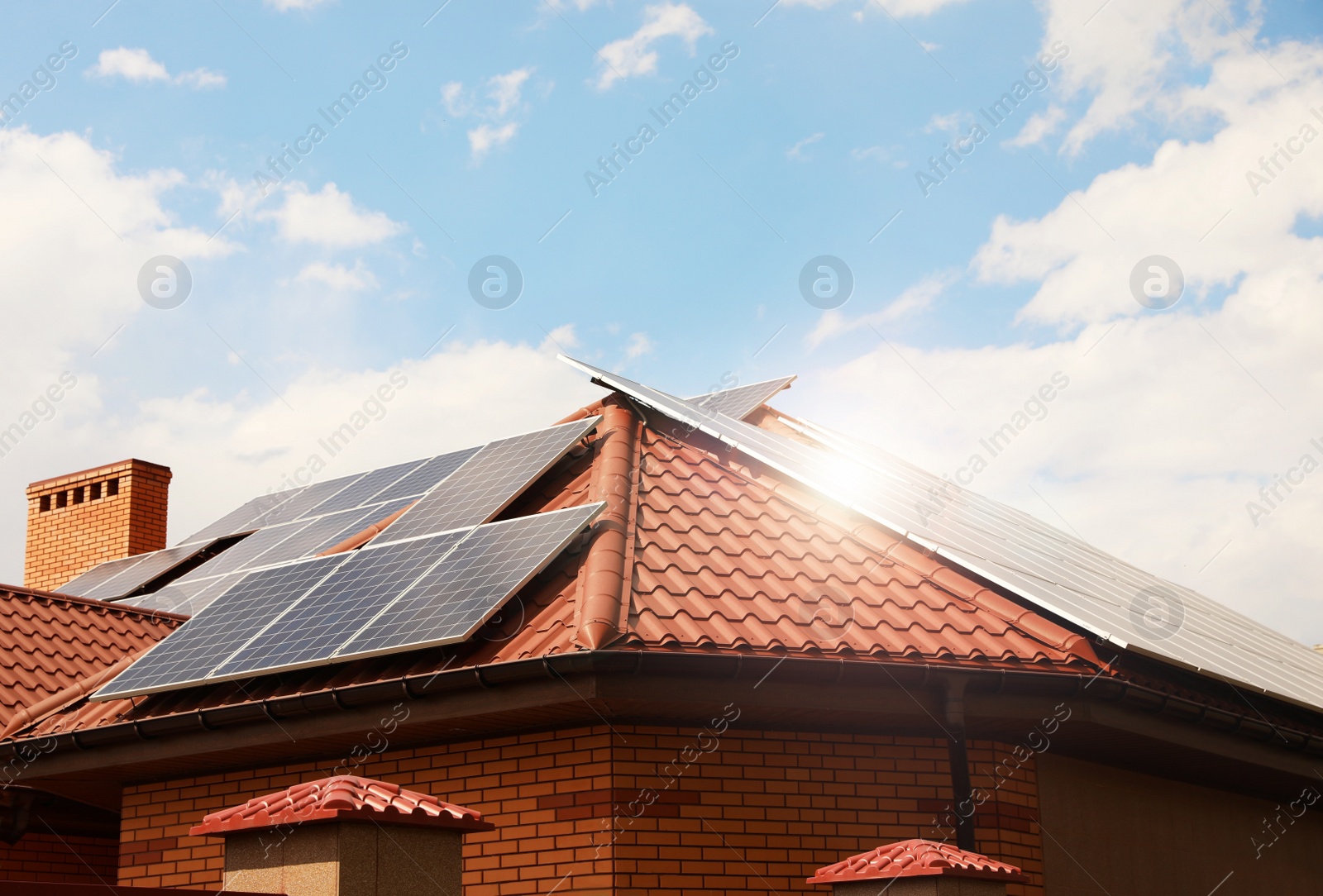 Photo of Building with installed solar panels on roof. Alternative energy source