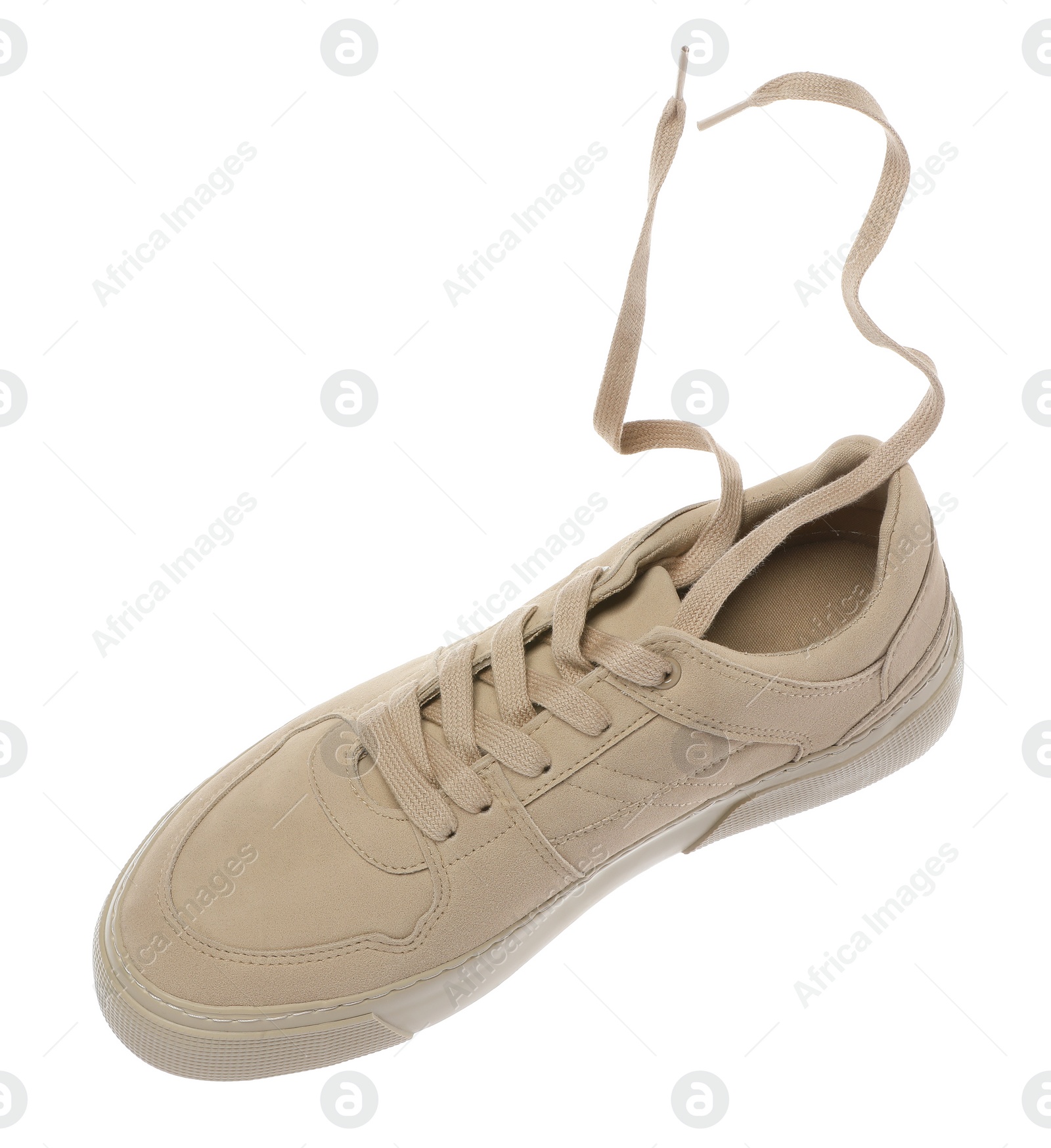 Photo of One stylish beige sneaker isolated on white