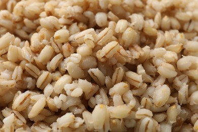 Photo of Delicious fresh pearl barley as background, closeup