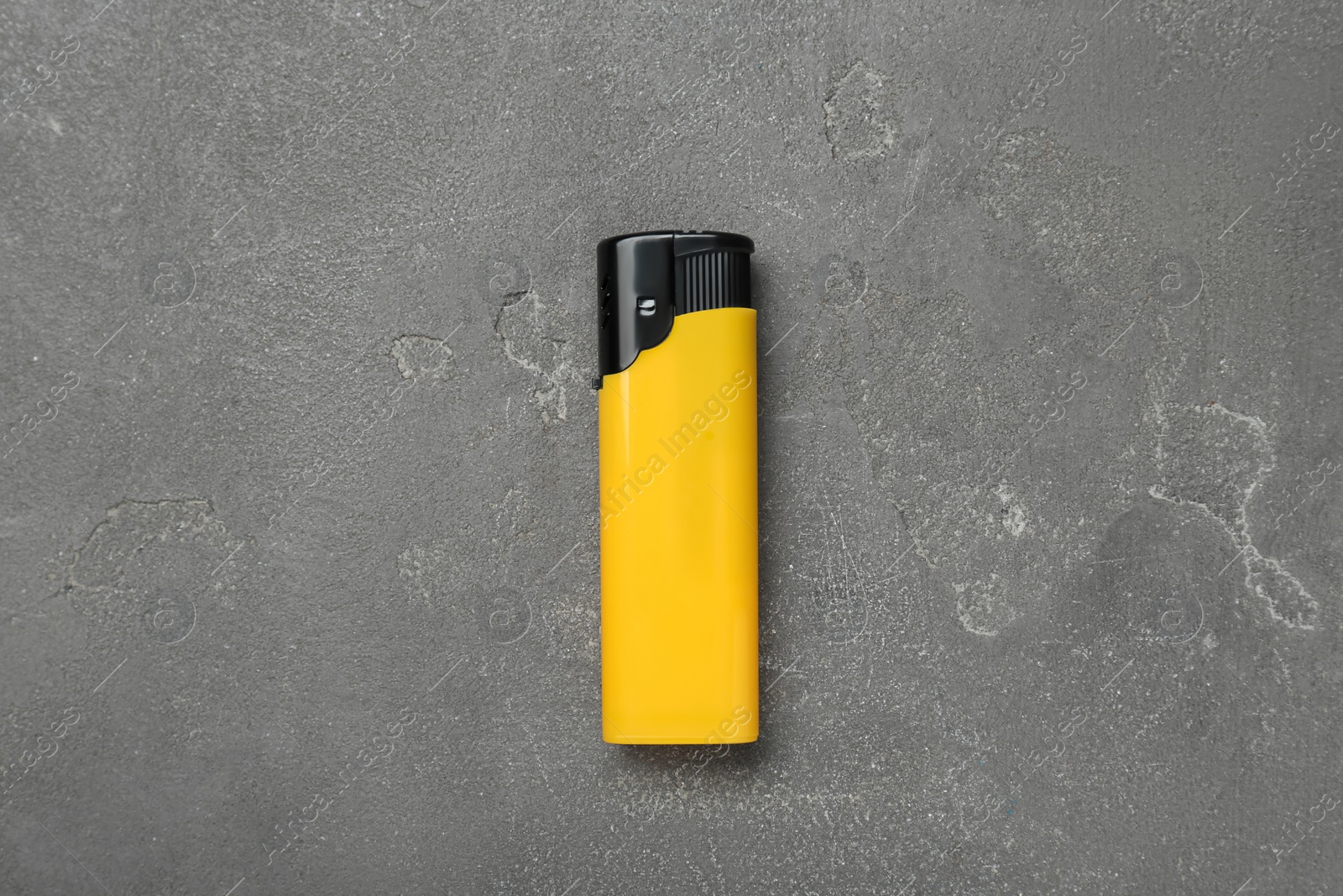 Photo of Stylish small pocket lighter on grey table, top view