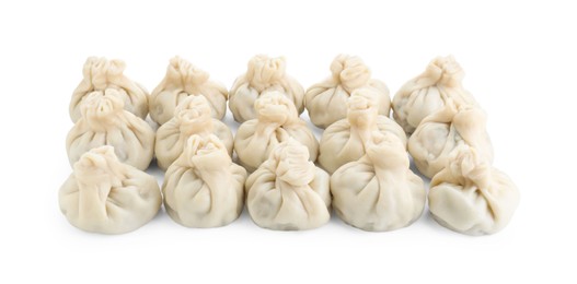 Many tasty khinkali (dumplings) isolated on white. Georgian cuisine