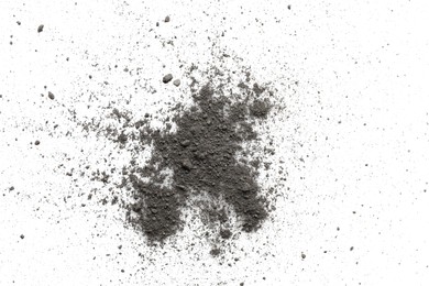 Pile of black dust scattered on white background, top view