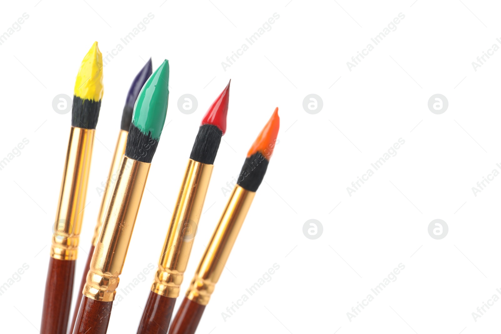 Photo of Brushes with colorful paints on white background