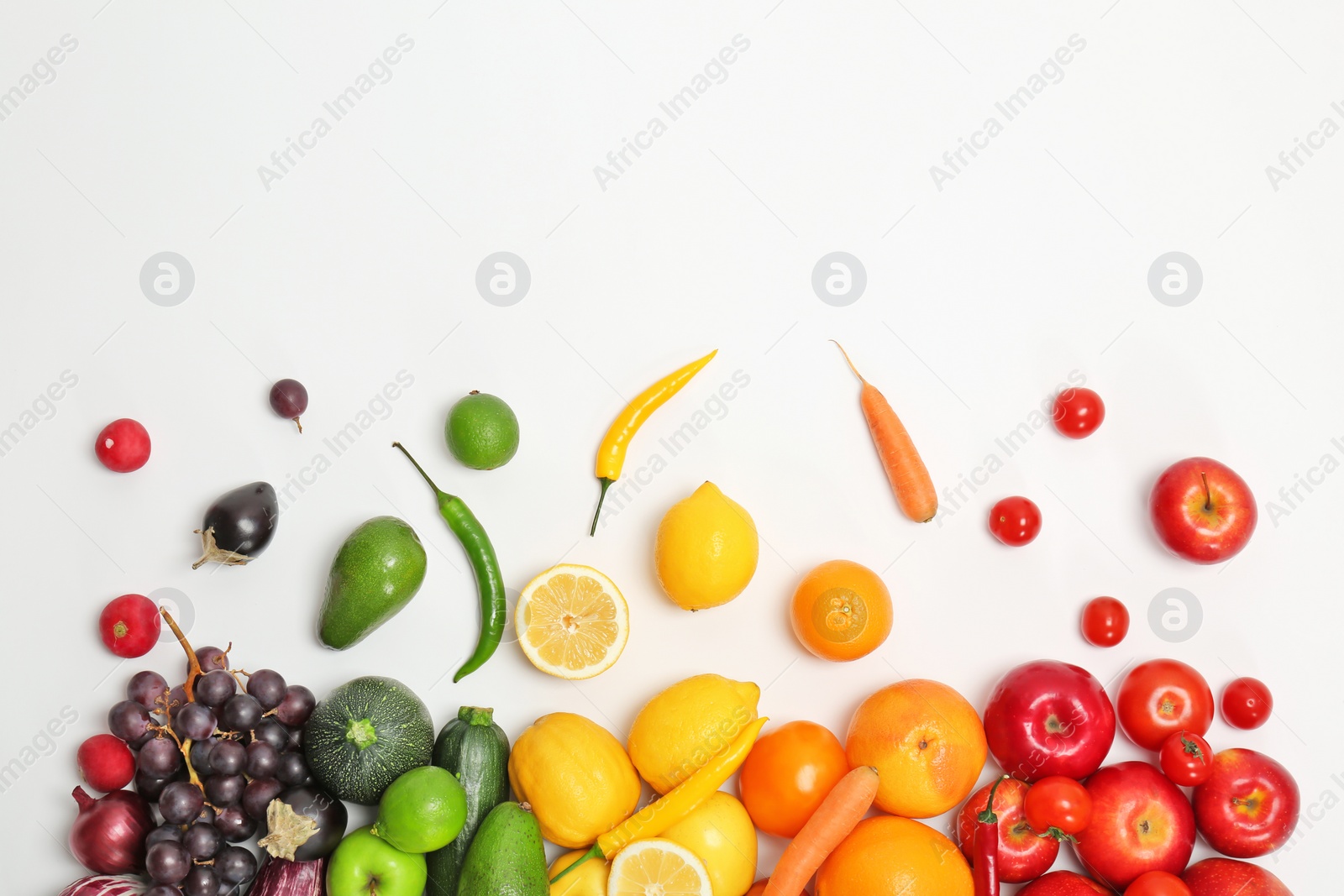 Photo of Rainbow composition with fresh vegetables and fruits on white background, flat lay