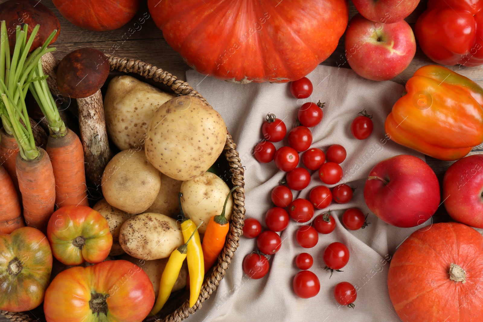 Photo of Different fresh ripe vegetables and fruits on wooden table, flat lay