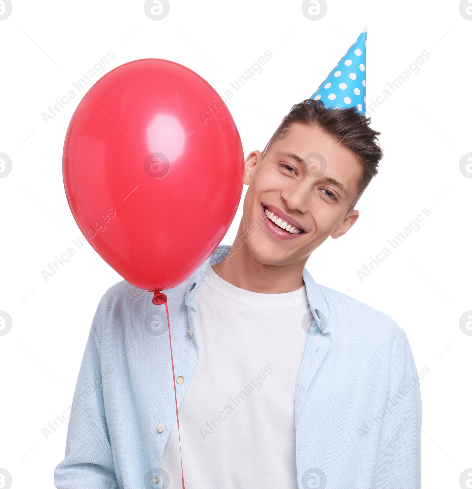 Photo of Happy young man in party hat with balloon on white background