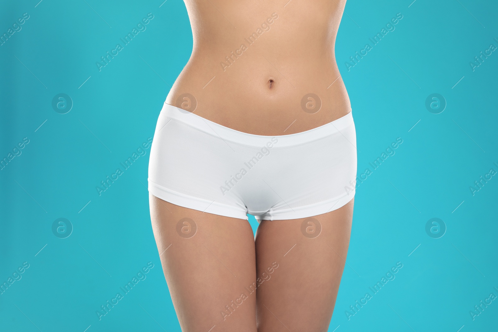 Photo of Slim young woman with smooth gentle skin on color background, closeup. Beauty and body care concept