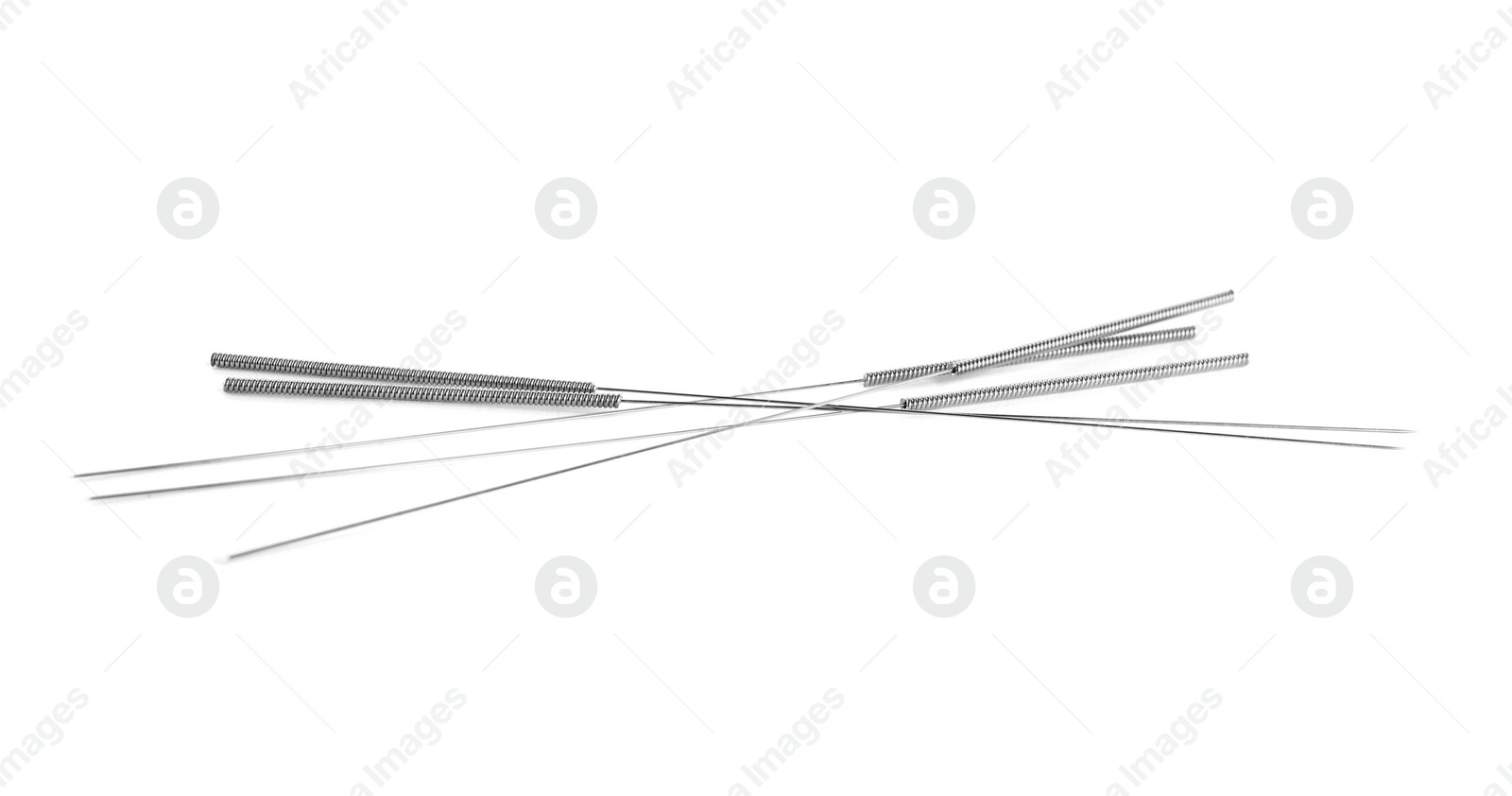 Photo of Many needles for acupuncture on white background