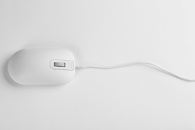 Modern wired optical mouse on white background, top view