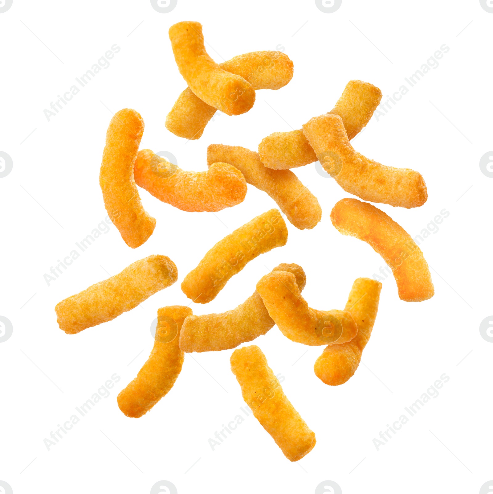 Image of Many tasty corn sticks falling on white background