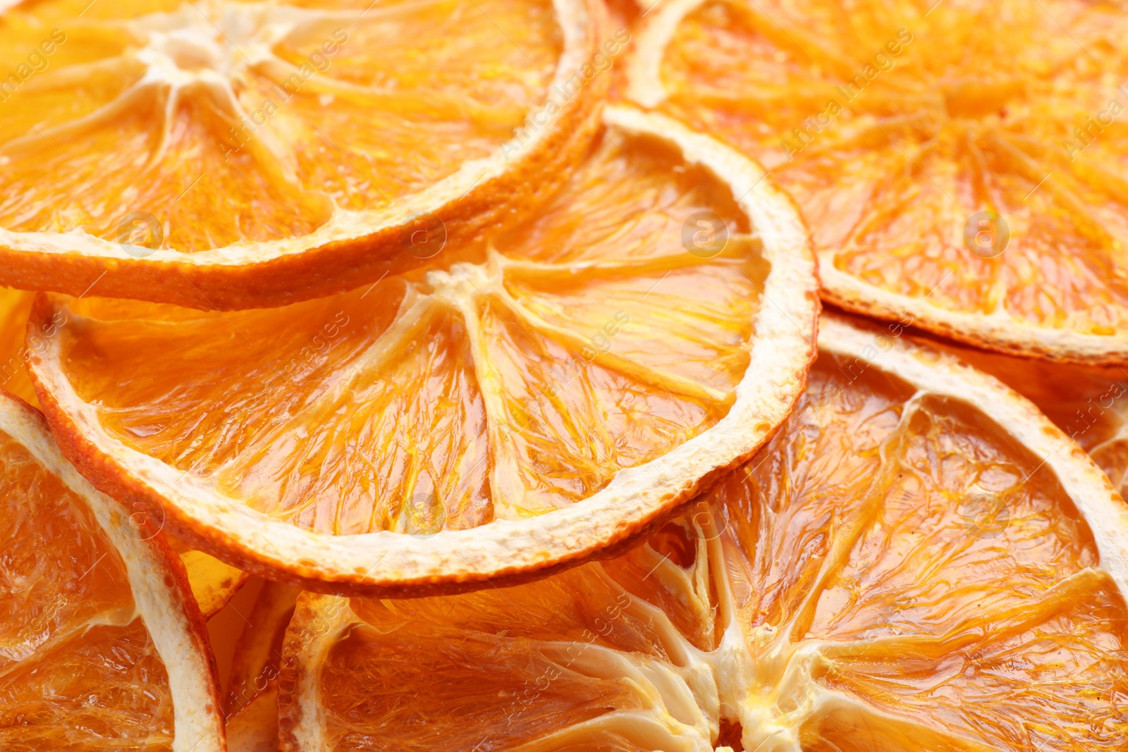 Delicious dry orange slices as background, closeup Photo of Delicious dry orange slices as background, closeup