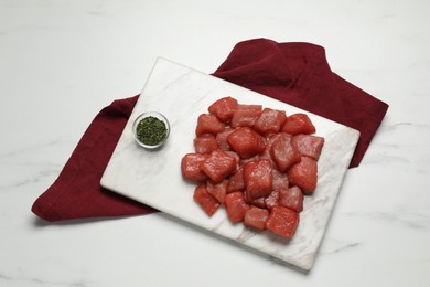 Cooking delicious goulash. Raw beef meat and spice on white marble table, top view