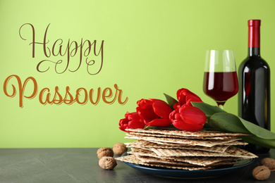 Image of Composition with Passover matzos on green background. Pesach celebration