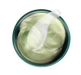 Photo of Under eye patches in jar with spatula isolated on white, top view. Cosmetic product