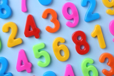 Photo of Colorful numbers on blue background, flat lay