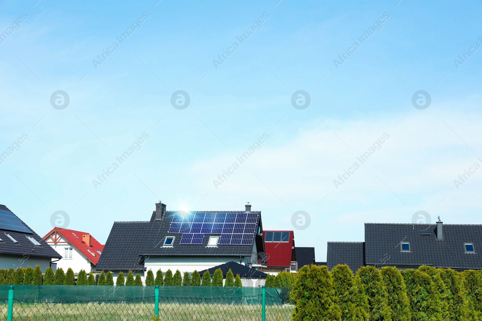 Photo of House with installed solar panels on roof, space for text. Alternative energy