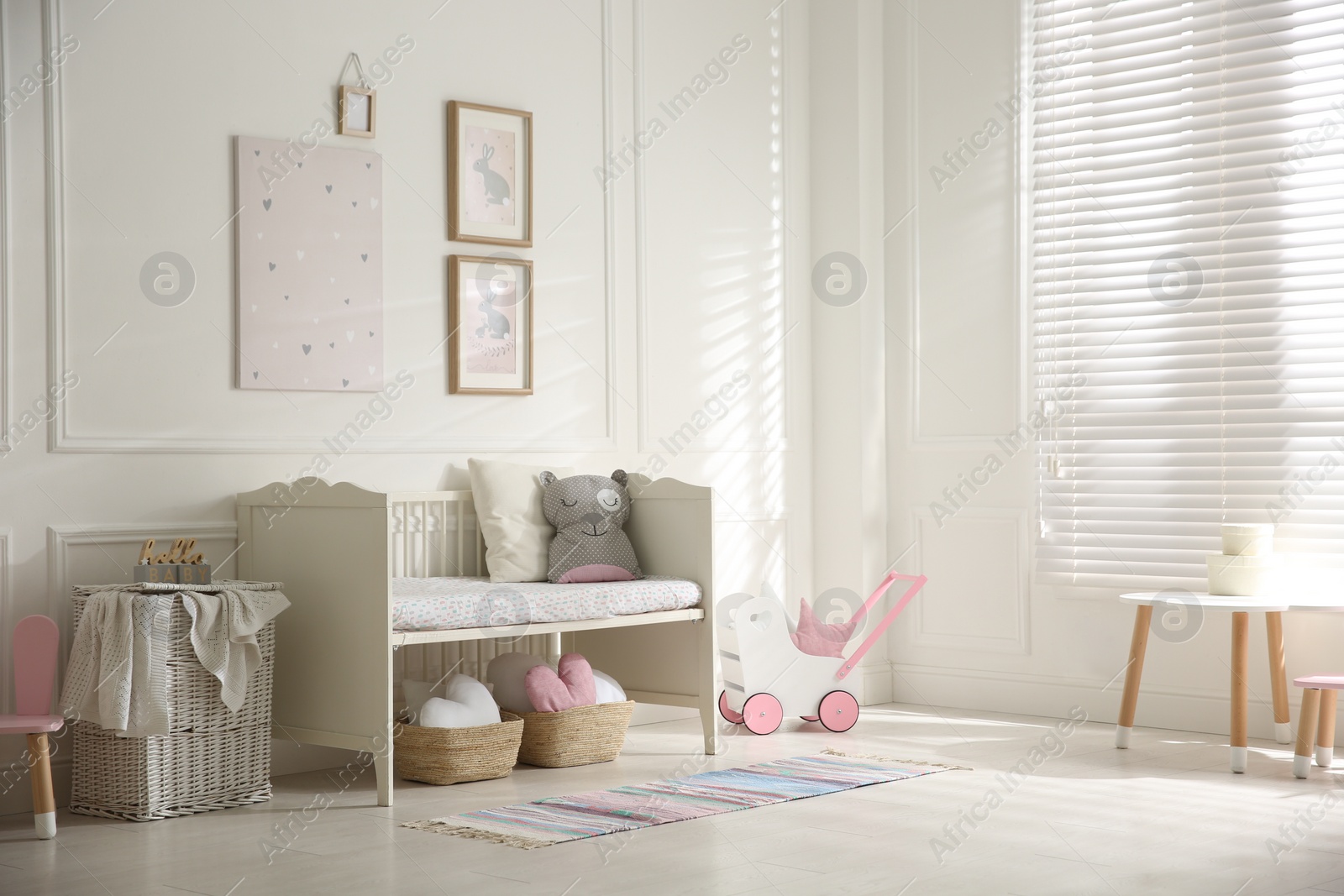 Photo of Baby room interior with stylish furniture and toys