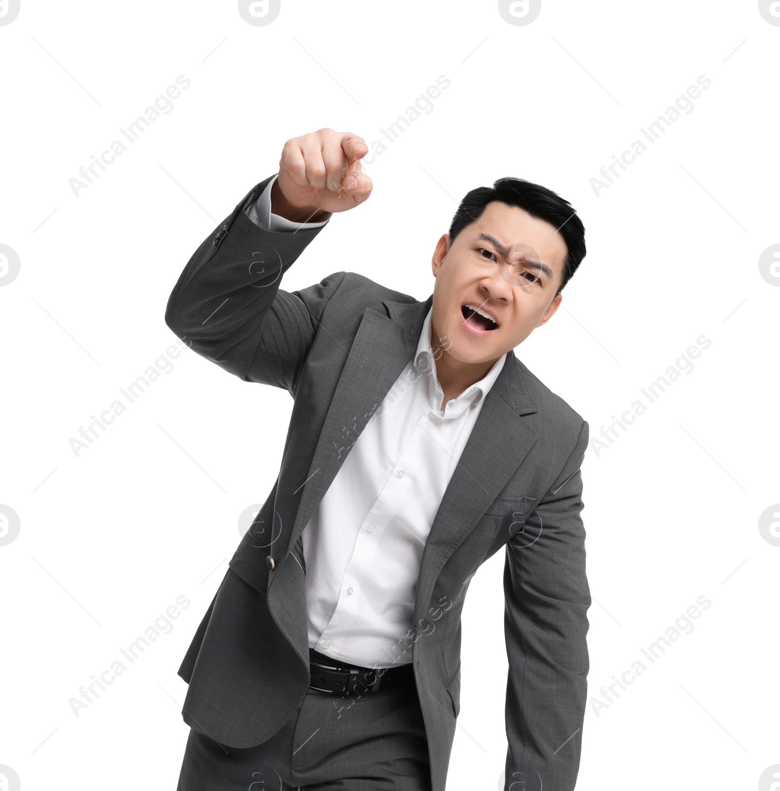 Photo of Angry businessman in suit screaming on white background, low angle view