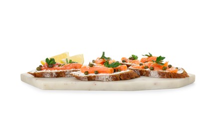 Tasty canapes with salmon, capers, lemon and cream cheese isolated on white