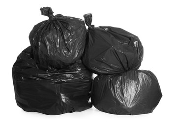 Black trash bags full of garbage on white background