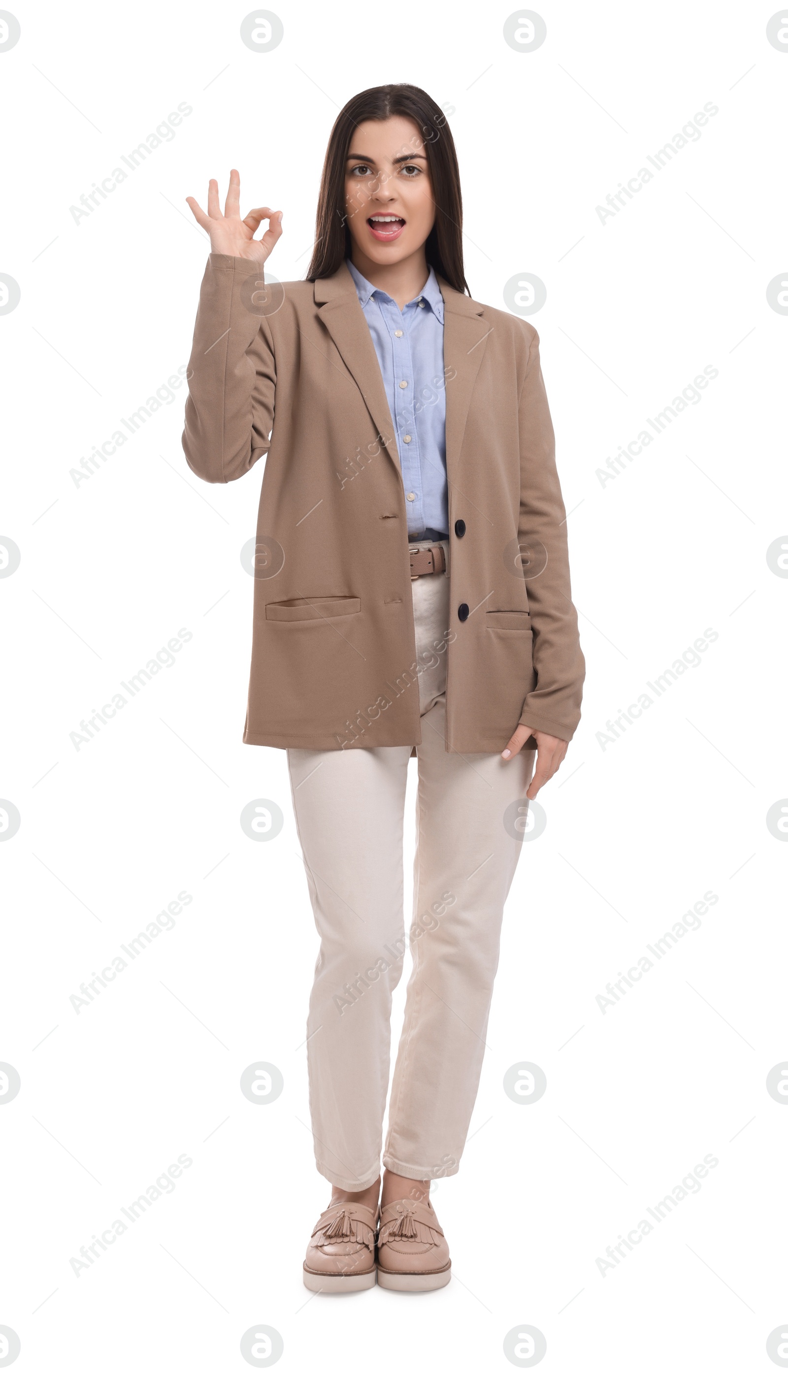 Photo of Beautiful businesswoman showing OK gesture on white background