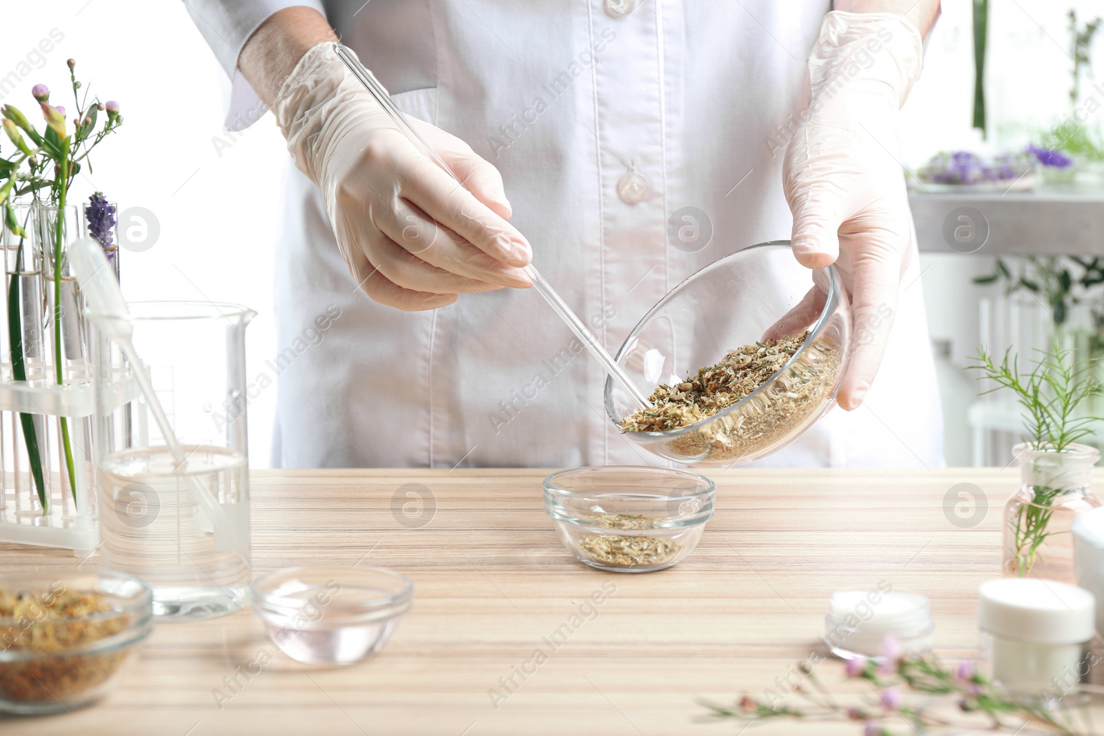 Photo of Scientist developing cosmetic product in laboratory, closeup