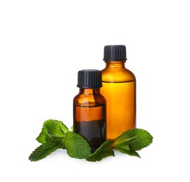 Bottles of essential oil and mint on white background