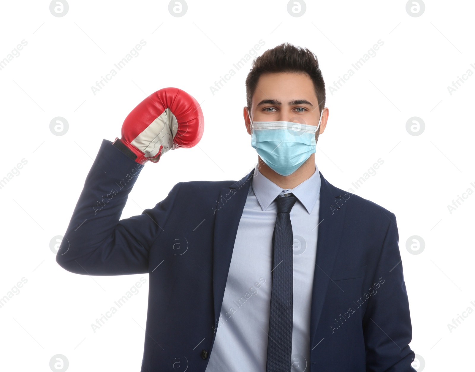 Photo of Businessman with protective mask and boxing gloves on white background. Strong immunity concept