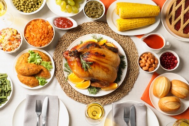 Delicious festive dinner with roasted turkey on table, flat lay